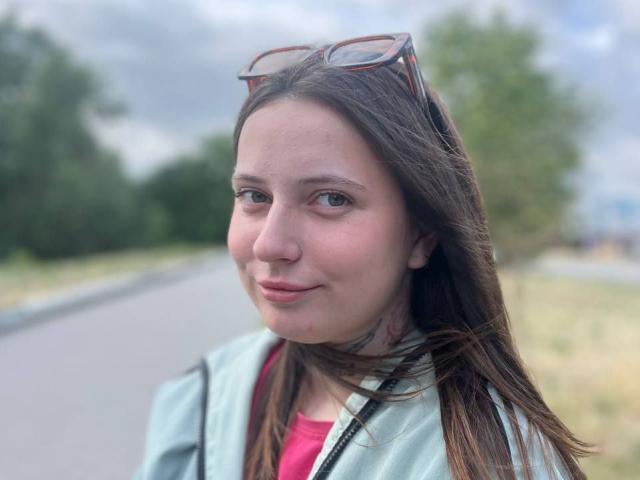 Digital illustration of a flat, minimalist style. Center has a large, pale red letter "V" with a smaller, darker red letter "V" inside. Simple, clean lines and solid colors.