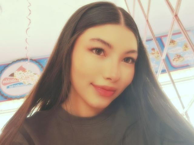 ViolettaLeroy, with long black hair and cute face, smiling slightly, wearing a black shirt, has smooth skin and brown eyes, looking at the camera, soft light.