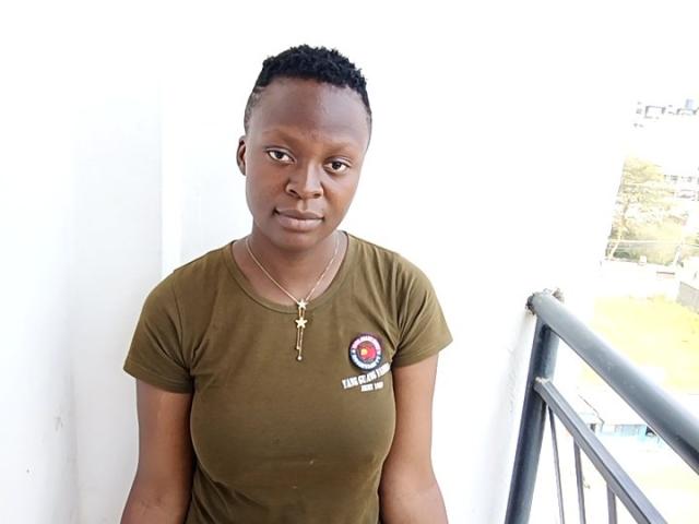 Close-up of a minimalist, flat-style logo with a bold, black outline and a central, red, semi-circular design. Simple, clean lines. Dark background, centered. No additional elements.