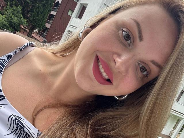 Digital art of a folded paper-like design with a central red and white emblem. Soft gradient colors, minimalist style. OnlyOneRose-hot's name in the top left, small watermark.