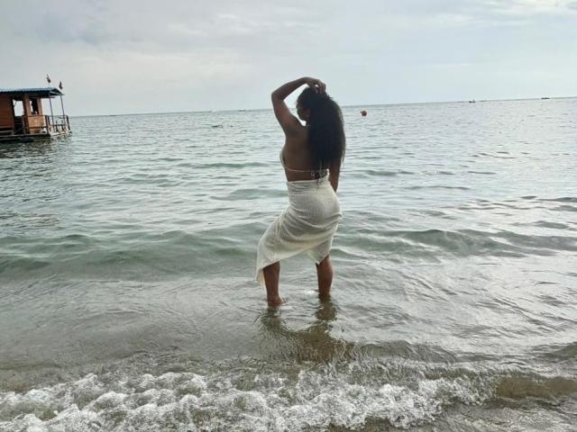 A digital image of a red Scandinavian-style letter "A" with a black cross in the center. Bold, flat colors. Minimalistic design. CarlaMuille not present. Simple, clean lines.