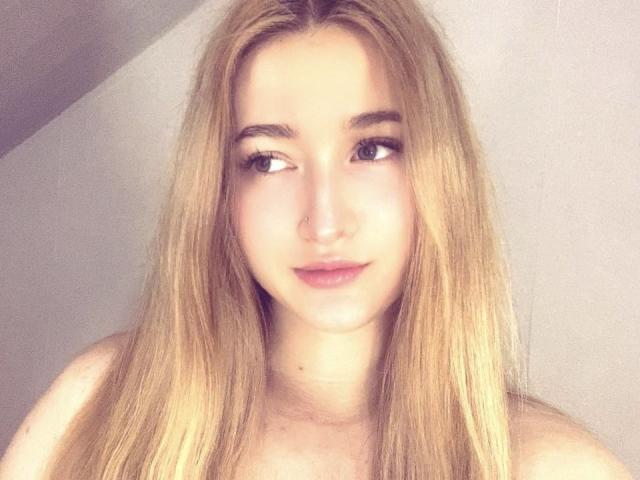 Minimalist-style illustration of a stylized letter "A" in bold, flat colors. Centered, with subtle shadowing. Simple, clean lines. Light pink and dark pink gradient. Modern, flat design.