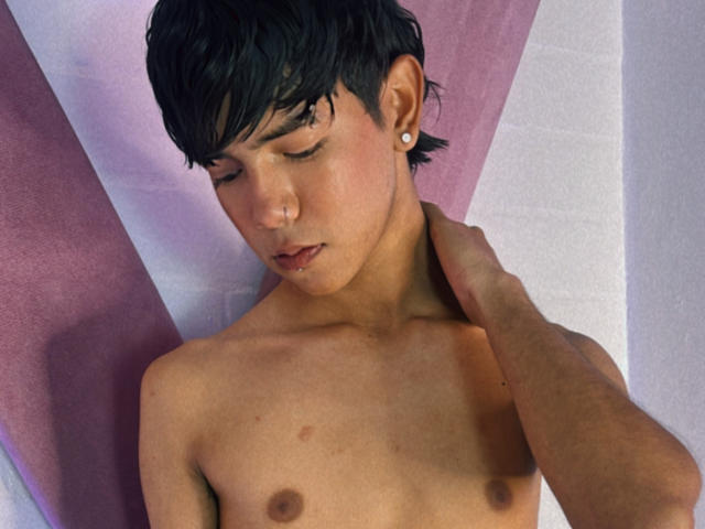 AresHearts, shirtless with short black hair, ear piercing, and small nipples, gets a hand on his neck, eyes closed, looking down, with a slightly flushed, handsome face.