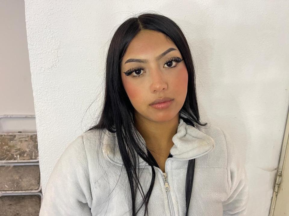 Digital art of a minimalist design featuring a large, flat, red and black emblem in the center. Simple, bold colors, clean lines, no additional elements or textures.