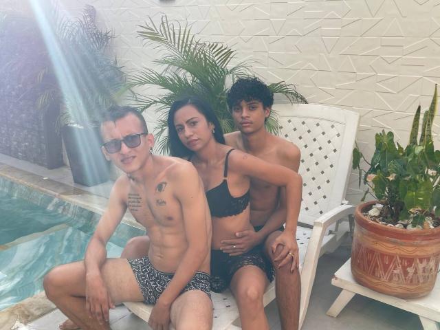 Three WorldSexxxADS: one with black tits in a bra, one with a cocky expression, and one with a tiny cock in swim trunks, sitting by a pool.