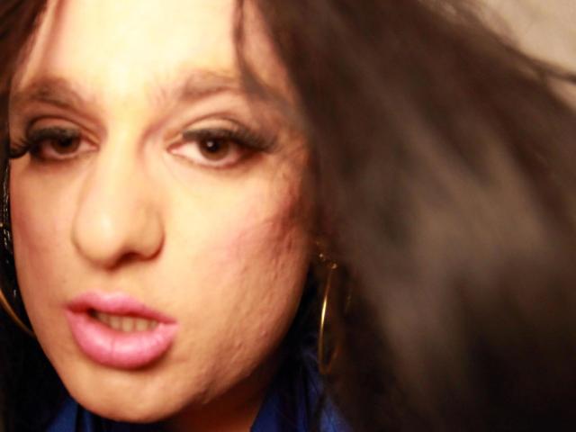 A flat, geometric design featuring five large, overlapping, light brown shapes with subtle gradients. The shapes have smooth, clean edges and a minimalist, modern aesthetic. Simple, bold composition.