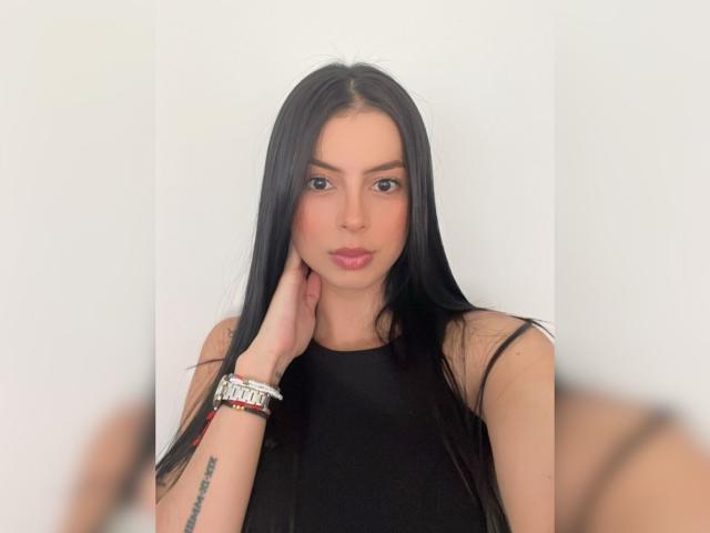 A flat, three-dimensional, stylized, red and black logo with bold, angular shapes and a subtle gradient. The design is modern and minimalist, featuring clean lines and a simple, symmetrical layout.