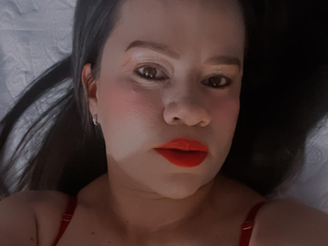 Flat, minimalist design with four bold, white, vertical, flat-edge shapes in the center. Light source from above. Colors are muted with a subtle red in the lower shape.