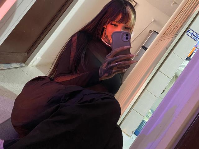 Stylized, digital logo with bold red and white geometric shapes. Central red triangle points upward, surrounded by white angular lines. Simple, modern design with clean edges and contrasting colors.