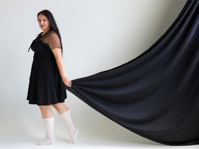 Minimalist design of a large, flat, white label with a small, red "V" in the bottom left corner. Bold, clean lines. Simple, modern aesthetic. No additional objects or textures.