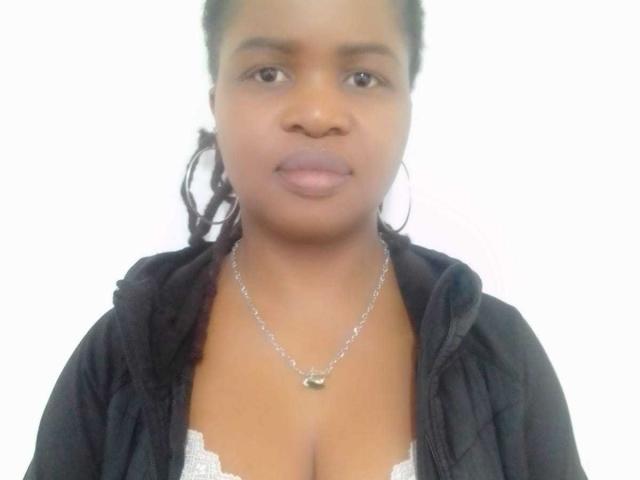RounderAss has medium brown skin, small tits, and wears a black zip-up hoodie with a white lace bra underneath, and a silver necklace with a small pendant.