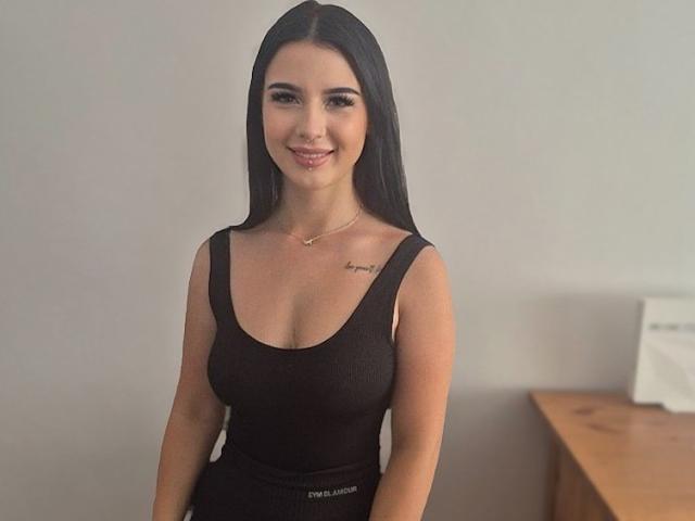 Close-up of a large, red and white, stylized letter "L" in the center. Flat, bold colors. Simple, geometric design. No additional objects or textures. Minimalist.