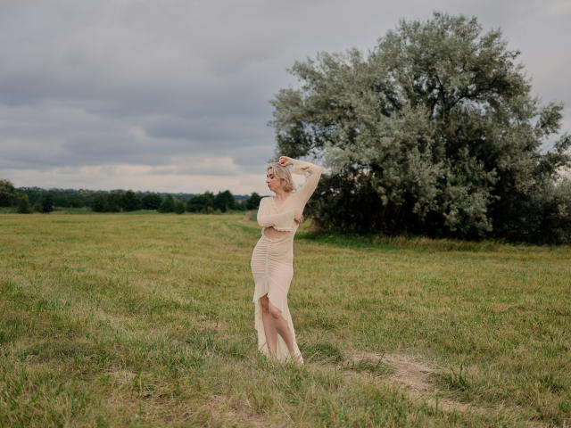 Close-up of a bold, minimalist design featuring a large, stylized letter "V" in dark red, centered with a smaller, lighter red "V" in the bottom right corner.