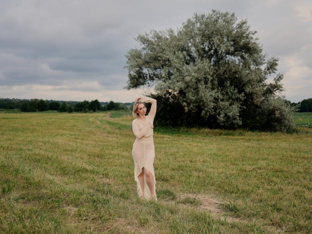 Flat, stylized design with a large, bold letter "E" in the center. Light brown and dark brown colors. Simple, geometric shapes. Minimalistic. VasilisaSexy not visible. Flat, 2D style.