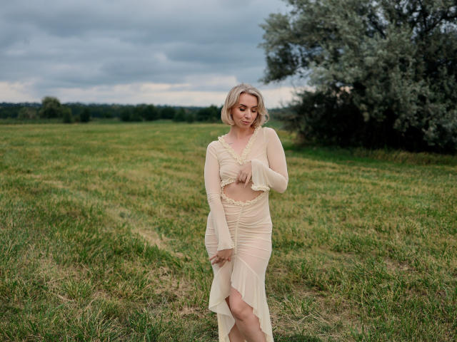 Minimalist design with a bold, blocky letter "A" in the center, filled with a soft pink-red gradient. The letter has a subtle shadow, creating a slight 3D effect.