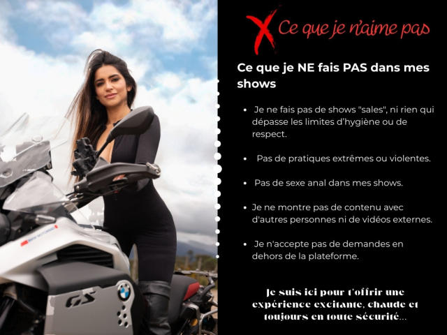 SofyaLane with long dark hair, standing next to a BMW motorcycle, wearing a tight black bodysuit, showing her ass and small tits, looking confident.