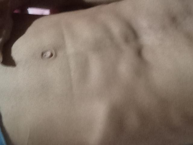 Morenhoh's abs, showing defined muscle lines and a small navel, with a slightly blurred, soft-focus texture. The image emphasizes Morenhoh's toned, flat stomach.