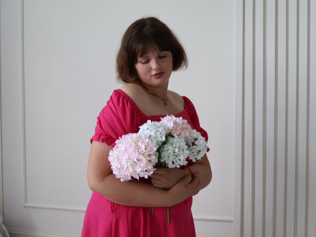 A detailed, flat design of a French flag with red, white, and blue elements, featuring a stylized fleur-de-lis at the bottom. Bold colors, simple shapes, and clear lines.