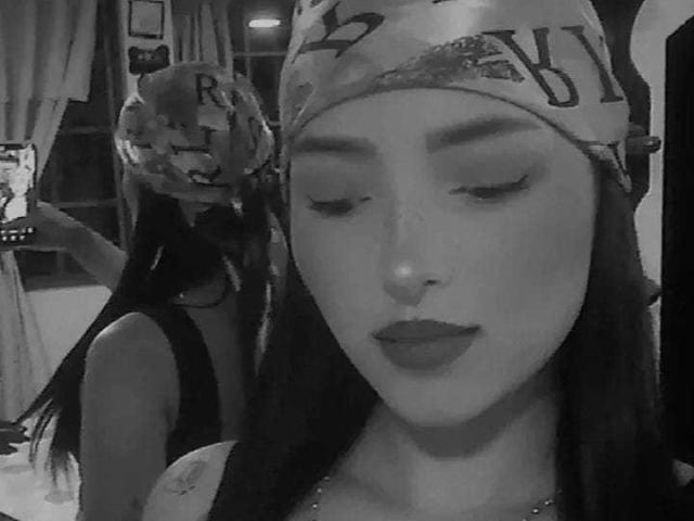 A close-up of a medieval-style coat of arms. The emblem features a bold, red central cross with smaller crosses in the corners. The design is simple and symmetrical.