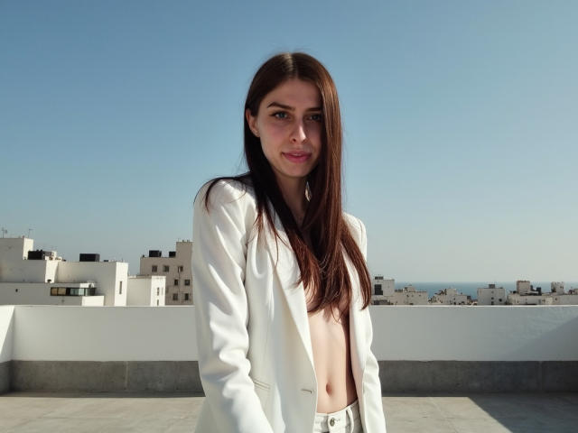 GlamPia with long brown hair, wearing a white blazer, exposing her small tits, standing on a rooftop, clear blue sky, and white buildings in the background.