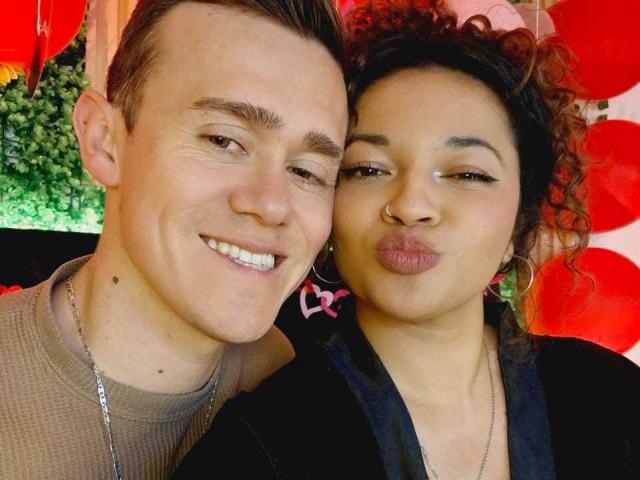 JenAndPatrick, a cute couple, with Jen puckering her lips and Patrick smiling. Jen has curly brown hair, hoop earrings, and a nose ring. Patrick has short brown hair and a necklace.