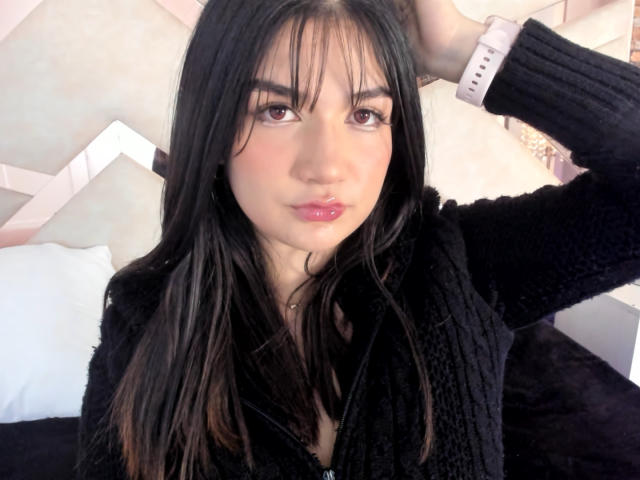 Digital art of a minimalist, stylized letter "V" in a soft pink and white color. Simple, clean lines with a subtle gradient. Centered, bold, and flat design.