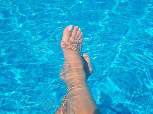 A flat, digital illustration of a red, double-lettered "V" inside a larger, light gray "V". Simple, bold lines and a clean, minimalist style. No additional textures or shadows.