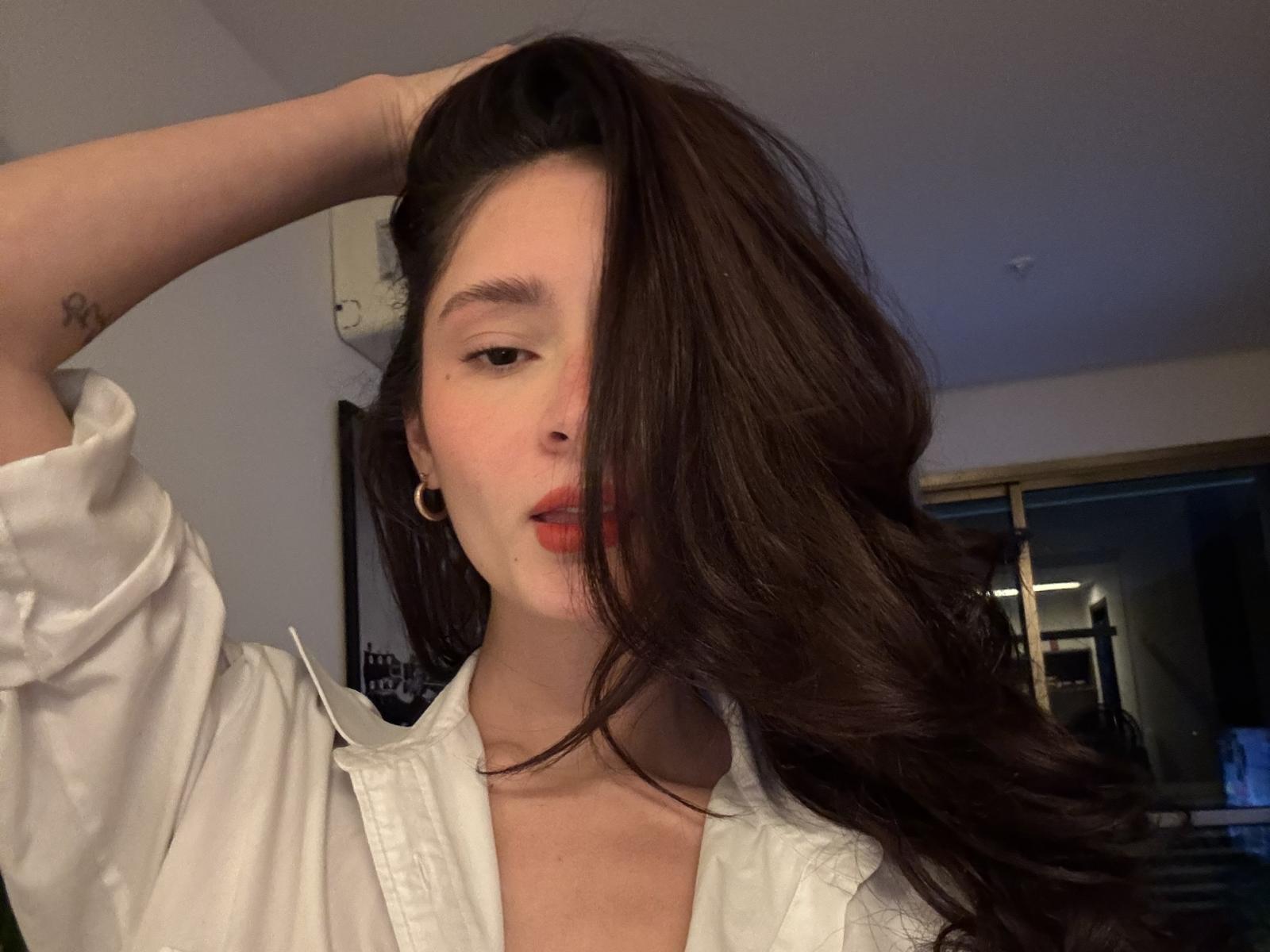 Close-up of a red and black Soviet-style hammer and sickle emblem. Simple, bold lines. Flat color palette. Centered, with hammer on left and sickle on right. Minimalist design.