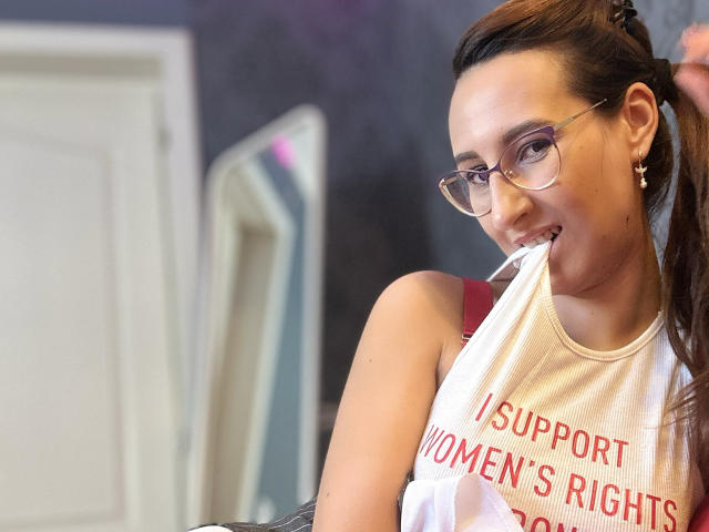 Flat, minimalist design with bold, black, white, and red colors. Large, overlapping letters "L" and "V" dominate the composition. Simple, geometric shapes. Clean, modern aesthetic.