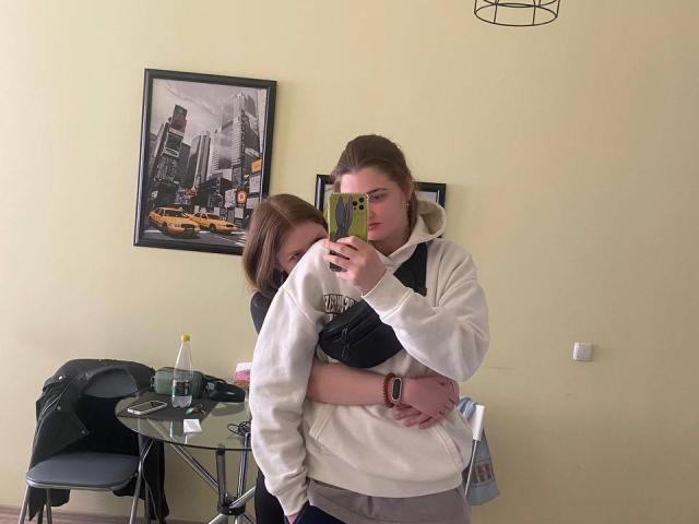 Flag with bold, dark red and black elements. Centered, large emblem with sharp angles. Flatter, more minimalist design compared to traditional flags. IngaFoxy not present. Simple, modern style.