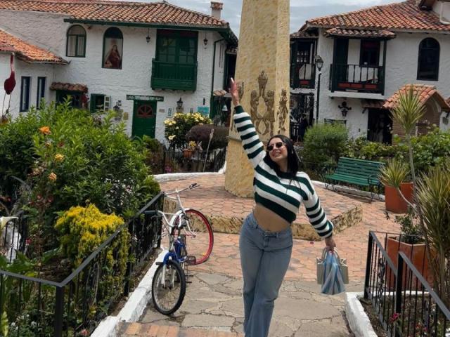 Minimalist drawing of a Nordic-style flag with red and black colors, featuring a simple, bold design. Clean lines, no textures. Central flag design, slightly raised, with small yellow dots.