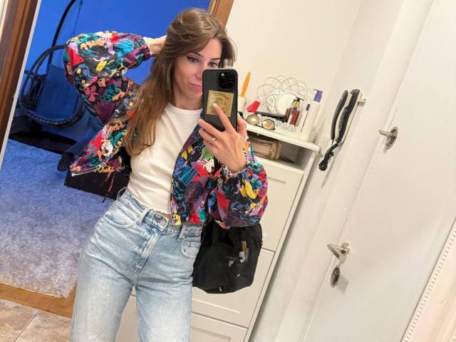 A bunch of bold, colorful, 3D-style letters stacked vertically. Each letter has a unique design with red, blue, and black patterns. Letters are spaced evenly, creating a balanced composition.