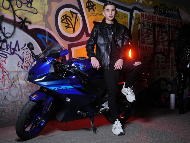 Minimalist illustration with flat colors. Central blue and red emblem, surrounded by bold white borders. Simple, geometric design. No textures, shadows, or gradients. Clean, modern style. Emphasis on emblem.