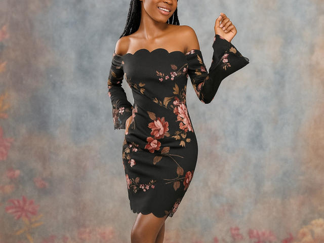 HotyBarbarha with dark skin, smiling, wearing a black off-shoulder floral dress, showing her tits and ass, standing with hands raised, background is a blurry floral pattern.