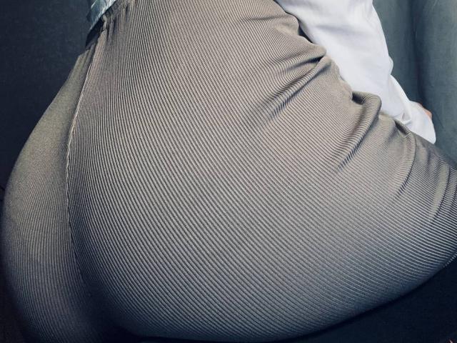 BalletSwan's big, ribbed, brown, ass is the focus. Her tight, grey, ribbed, pants are stretched over her round butt, showing the texture and curves.