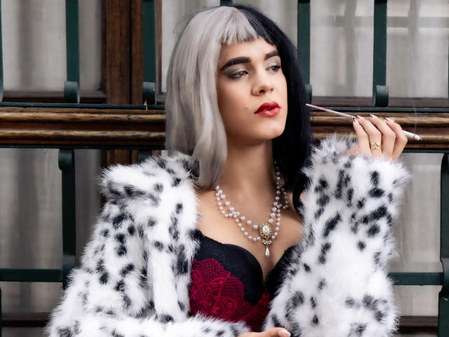 AliceCoolenk with black and white bob, wearing red lace bra, fur coat, pearl necklace, holding cigarette, red lipstick, holding ring, sexy, pouty, looking away, pale skin.