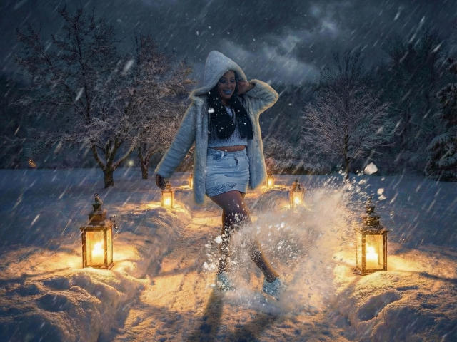 JessyLuxs in a fluffy white hood, blue denim skirt, and black top, splashing through snow, surrounded by glowing lanterns, dark night, and falling snowflakes.