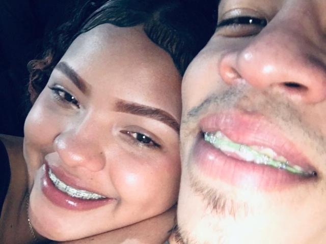 DirtyCoupleXy has shiny brown eyes and a big smile with glittery teeth, while DirtyCoupleXy has a mustache, goatee, and shiny green glittery teeth, both close to the camera.