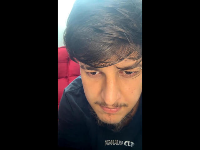 BigJota, a brown-haired dude with a small mustache, looking down with a slight smirk, wearing a black shirt, has a light skin tone and is in a selfie.