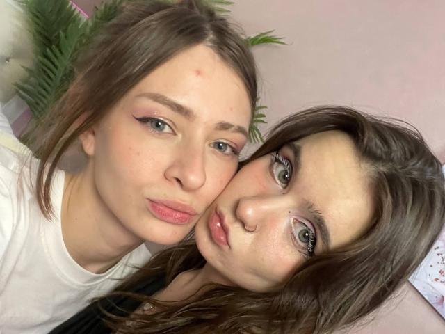 MaoandLulu with pouty pink lips, subtle makeup, and brown hair, next to MaoandLulu with green eyes, nose ring, and brown hair, both looking at camera.