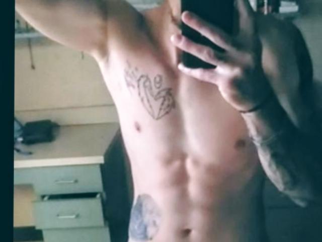 AlenBinx, shirtless, holding phone, mirror selfie, toned abs, tattoo on chest, tattoo on arm, visible tattoos, taking photo, mirror reflection, upper body, tattoos, tattoos on torso.