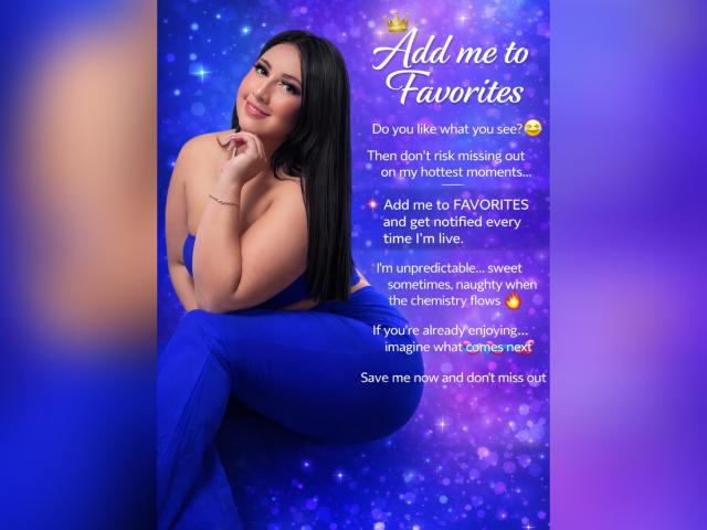 AshleeyPrinces, with long black hair, blue dress, and curvy ass, smiles at the camera, resting her chin on her hand, against a purple, sparkling background.