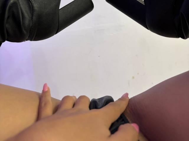 LaurentRay's pussy, with hands spreading it, wearing black high heels, nails painted pink, LaurentRay's thighs visible, black fabric partially covering pussy.