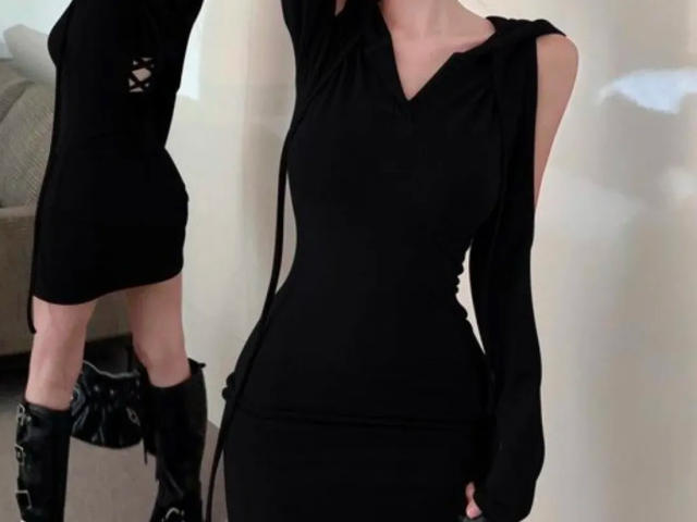 Two Lizees in black, form-fitting dresses with cutouts and long sleeves. One has black boots, the other is bare-shouldered. Sexual tension, slim figures, dark clothing, light background.