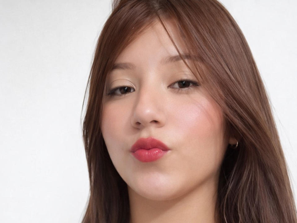 Nattaly69 has brown hair, light skin, and is pouting with pink lips. Her makeup is subtle, and she's looking slightly to the side with a neutral expression.