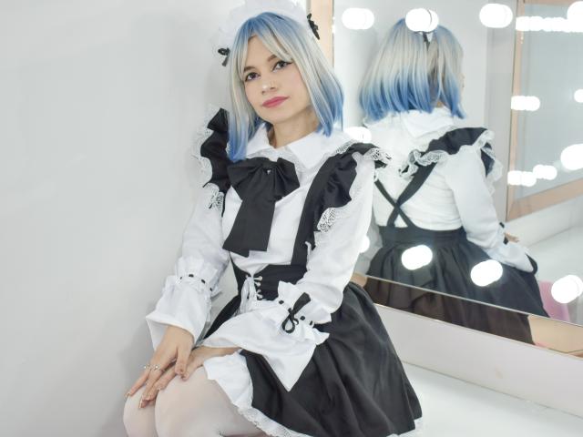 SofiArias with blue and white hair, wearing a black and white maid outfit, sitting in front of a mirror, showing her ass in the reflection, with white thigh-highs.