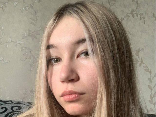 A flat, stylized logo with a large, dark letter "B" in the center. The "B" is surrounded by a lighter, pinkish-beige border. Simple, modern design.