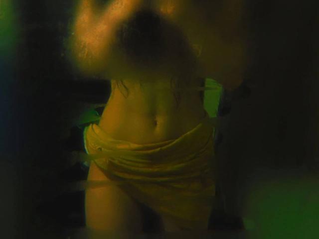 Close-up of a simplified, flat-style illustration featuring a central red flame with orange and yellow gradients, flanked by two smaller blue flames. Clean, bold lines dominate the composition.