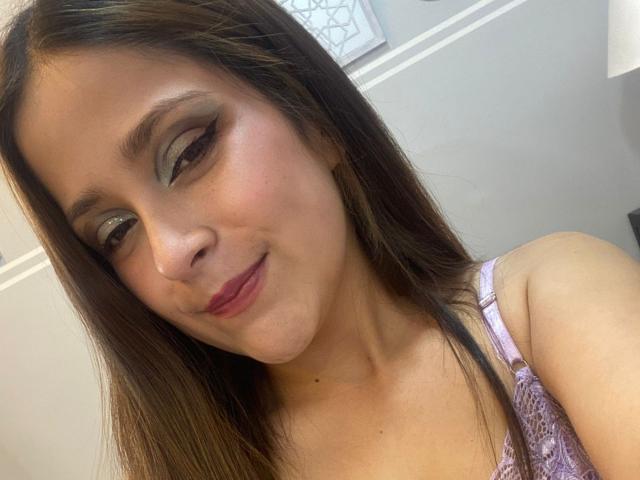 Digital art of a medieval-style coat of arms with a white emblem on a red background. Simple, bold lines. Red and white colors dominate. Emblem centered. Minimalist design.