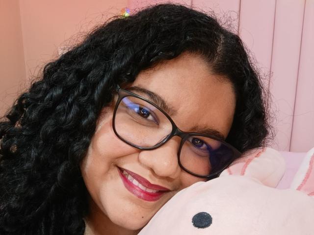 A digital illustration of a bold, stylized letter "A" in a dark, almost black color with a subtle gradient to pinkish-red. The letter is centered, with smooth, clean edges.